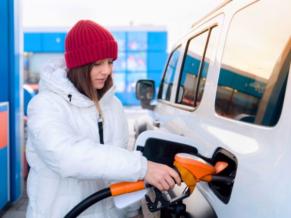 Woman Refuelling Car